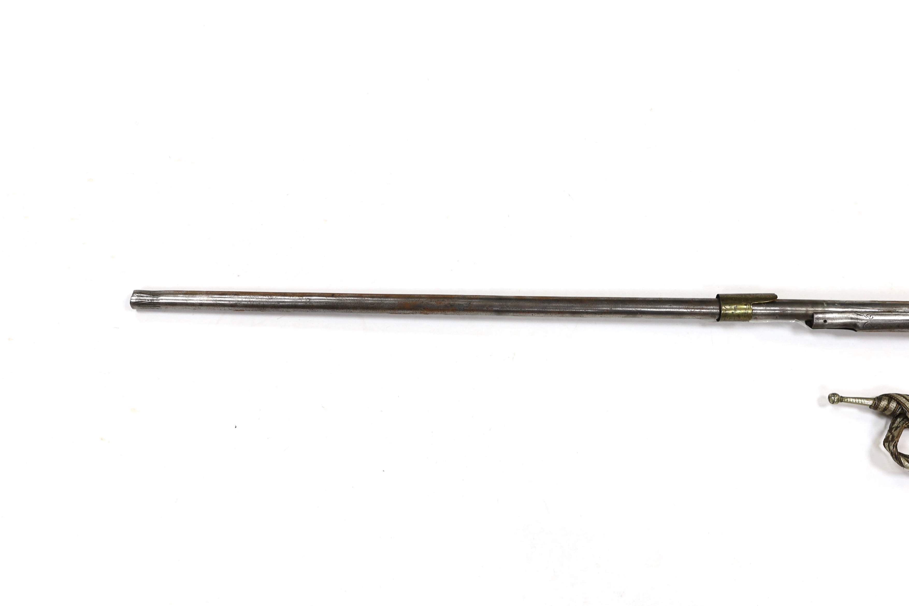 A 19th century Albanian flintlock miquelet lock rifle (Balkan long arm) and a Caucasian style dagger, with niello work scabbard, barrel 122cm (2)